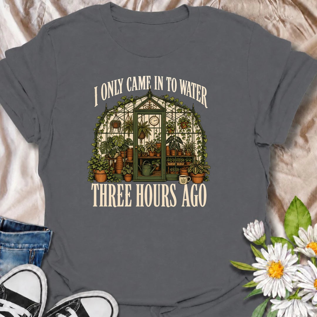 A funny greenhouse T-shirt for plant lovers who visit for one quick watering job and somehow stay for hours. A great gift for gardeners and plant parents.