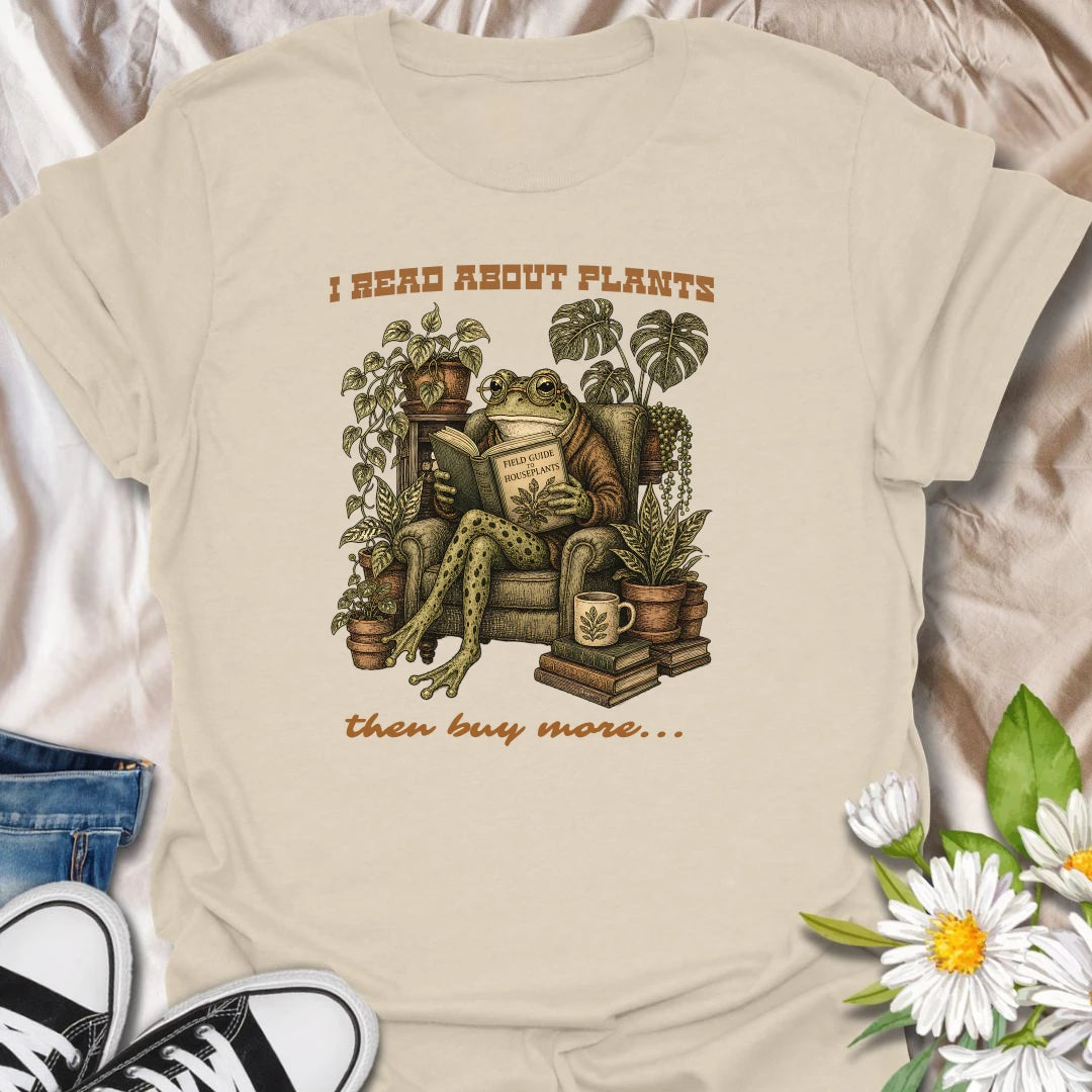 This I Read About Plants Then Buy More t-shirt is made for houseplant lovers who know learning about plants usually leads to bringing home another one. Featuring a detailed vintage-style frog reading a field guide surrounded by lush houseplants, books, and botanical details, this design has a cozy plant-collector feel with a funny relatable message. Perfect for plant moms, plant dads, indoor gardeners, frog lovers, houseplant collectors, and anyone whose plant research always ends in shopping.Natural