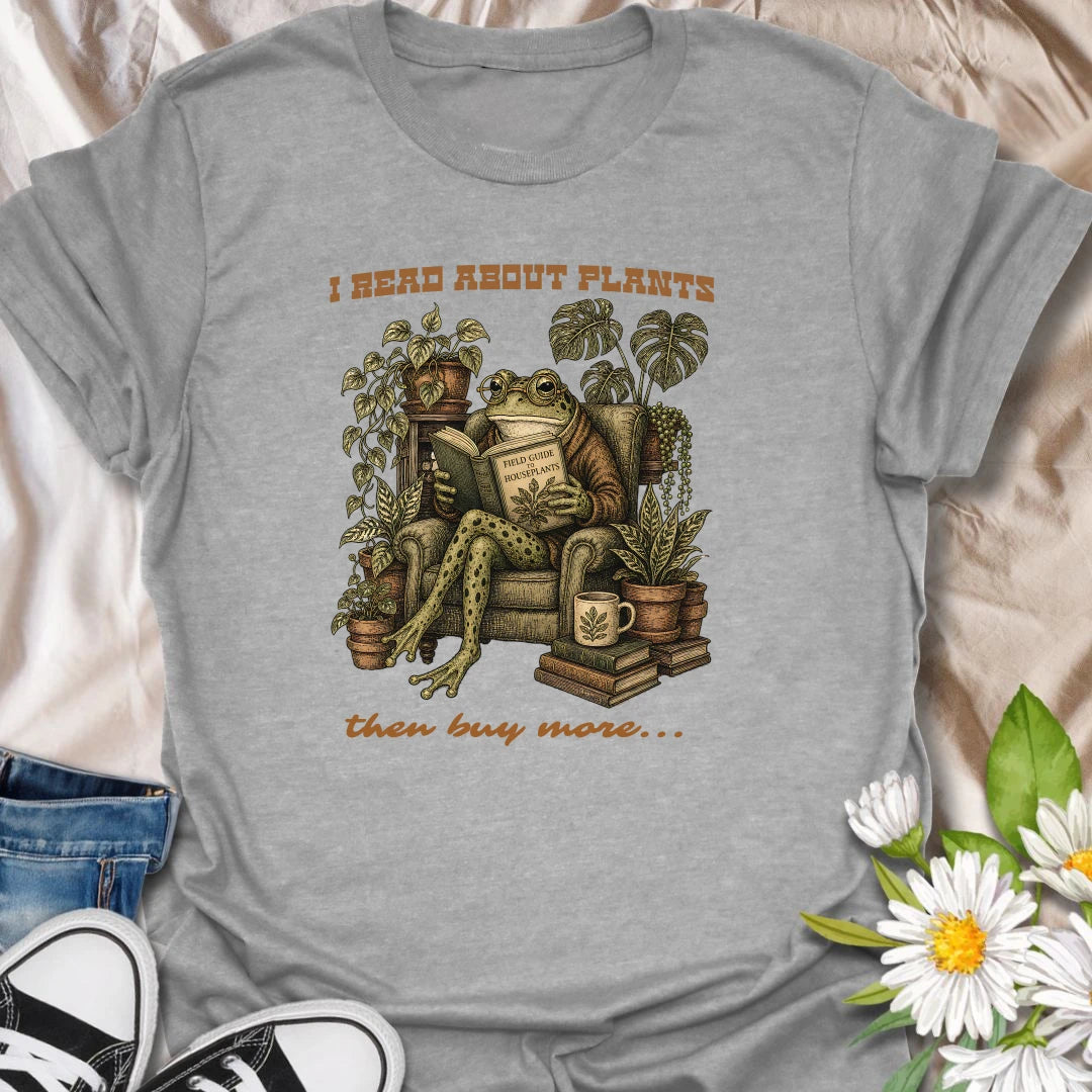 This I Read About Plants Then Buy More t-shirt is made for houseplant lovers who know learning about plants usually leads to bringing home another one. Featuring a detailed vintage-style frog reading a field guide surrounded by lush houseplants, books, and botanical details, this design has a cozy plant-collector feel with a funny relatable message. Perfect for plant moms, plant dads, indoor gardeners, frog lovers, houseplant collectors, and anyone whose plant research always ends in shopping.