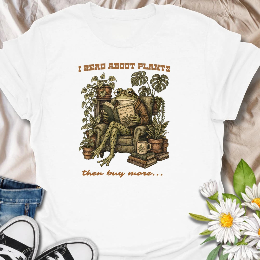 This I Read About Plants Then Buy More t-shirt is made for houseplant lovers who know learning about plants usually leads to bringing home another one. Featuring a detailed vintage-style frog reading a field guide surrounded by lush houseplants, books, and botanical details, this design has a cozy plant-collector feel with a funny relatable message. Perfect for plant moms, plant dads, indoor gardeners, frog lovers, houseplant collectors, and anyone whose plant research always ends in shopping.