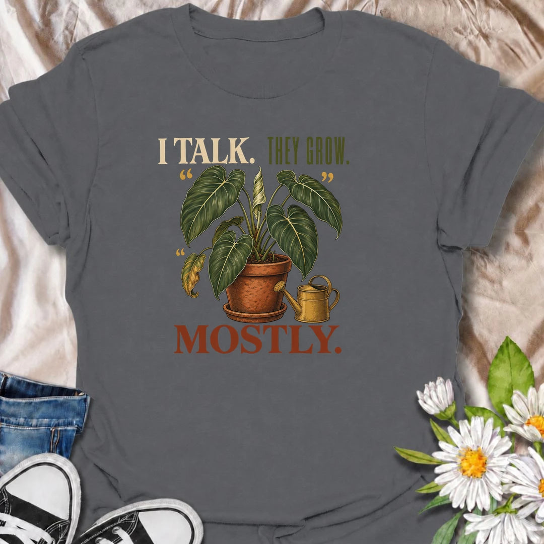 Funny plant lover T-shirt for anyone who talks to their houseplants and likes to believe it helps. Featuring a large vintage potted plant and playful “I Talk. They Grow. Mostly.” wording, this is a fun shirt for indoor gardeners, plant parents and enthusiastic houseplant collectors.