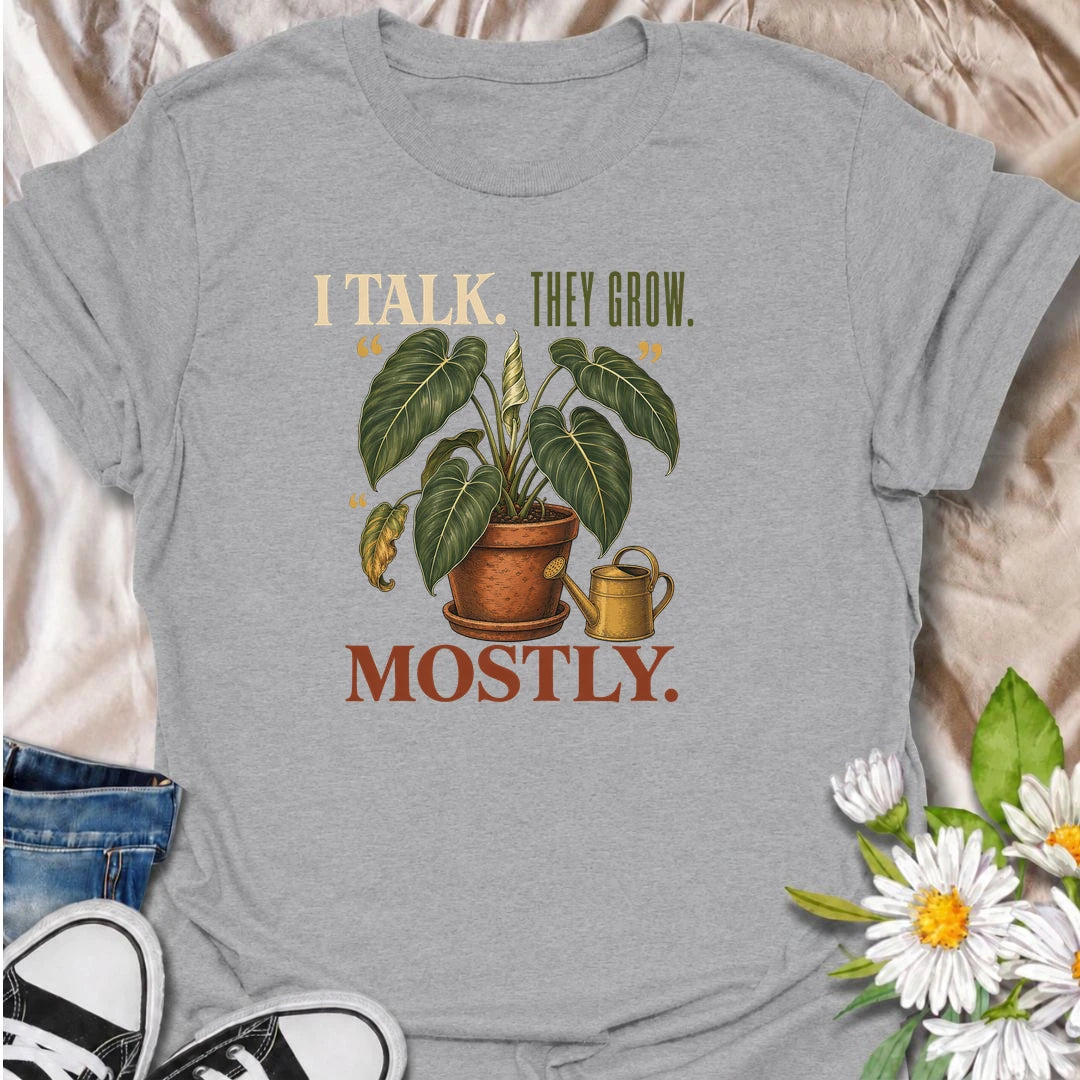 Funny plant lover T-shirt for anyone who talks to their houseplants and likes to believe it helps. Featuring a large vintage potted plant and playful “I Talk. They Grow. Mostly.” wording, this is a fun shirt for indoor gardeners, plant parents and enthusiastic houseplant collectors.