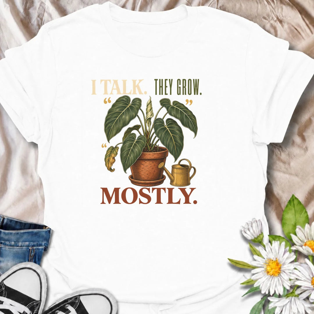 Funny plant lover T-shirt for anyone who talks to their houseplants and likes to believe it helps. Featuring a large vintage potted plant and playful “I Talk. They Grow. Mostly.” wording, this is a fun shirt for indoor gardeners, plant parents and enthusiastic houseplant collectors.