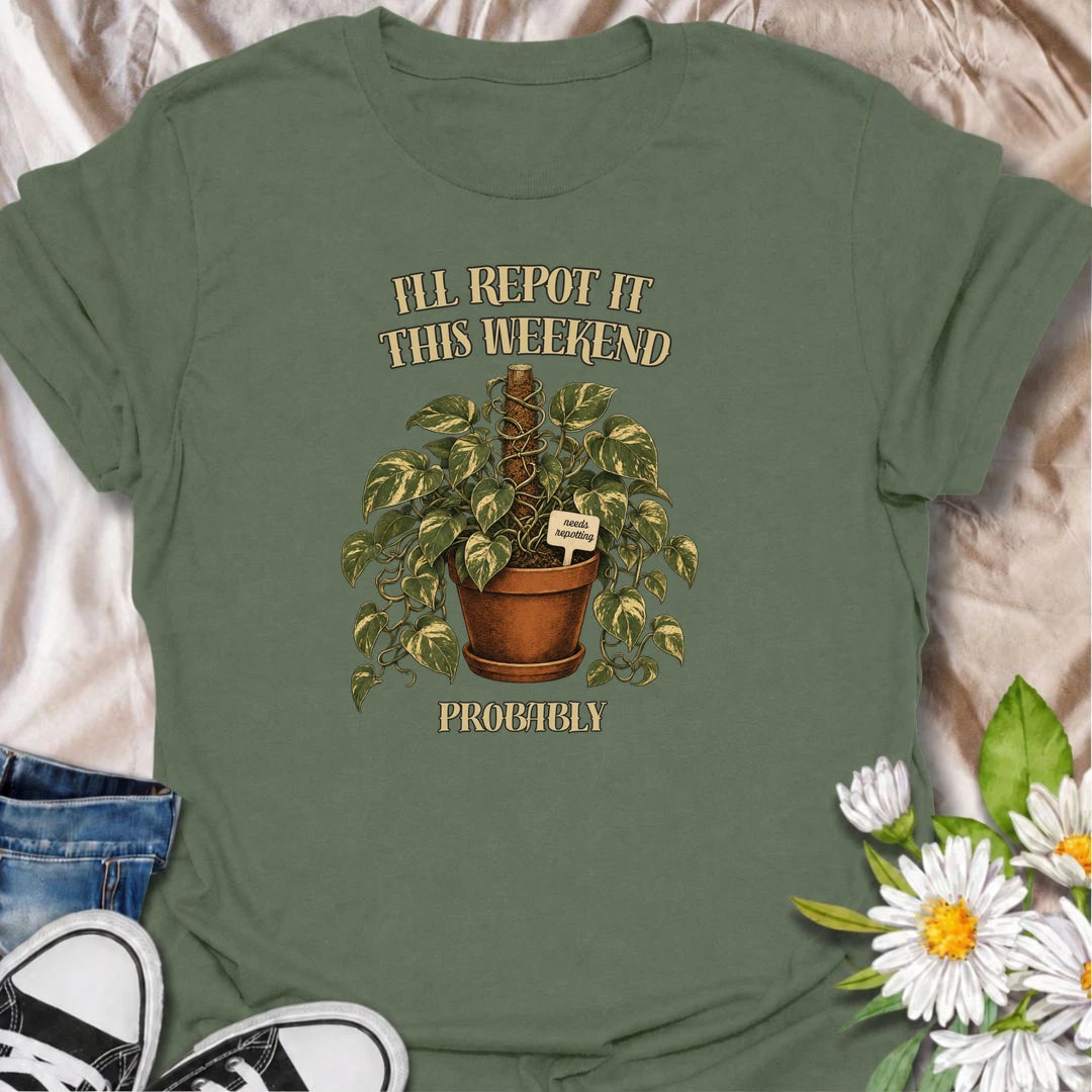 A funny plant T-shirt for anyone who keeps putting off that repotting job for just one more day. Featuring a lush trailing houseplant in a terracotta pot with a cheeky “Needs Repotting” tag, this design is perfect for plant parents and indoor gardeners. The phrase “I’ll Repot It This Weekend. Probably.” captures the procrastination every houseplant lover knows too well. It makes a great gift for pothos fans, plant collectors, and anyone with a growing list of plant-care jobs. Ideal for nursery trips, plant 
