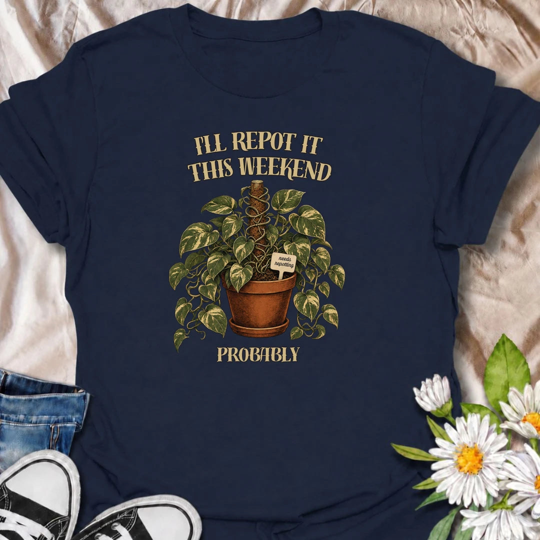 A funny plant T-shirt for anyone who keeps putting off that repotting job for just one more day. Featuring a lush trailing houseplant in a terracotta pot with a cheeky “Needs Repotting” tag, this design is perfect for plant parents and indoor gardeners. The phrase “I’ll Repot It This Weekend. Probably.” captures the procrastination every houseplant lover knows too well. It makes a great gift for pothos fans, plant collectors, and anyone with a growing list of plant-care jobs. Ideal for nursery trips, plant 