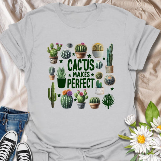 Fun cactus-themed t-shirt with colorful potted succulents and the playful phrase “Cactus Makes Perfect.” Ideal for plant parents, desert garden fans, and lovers of greenery with a sense of humor. Great gift for cactus collectors and gardeners.