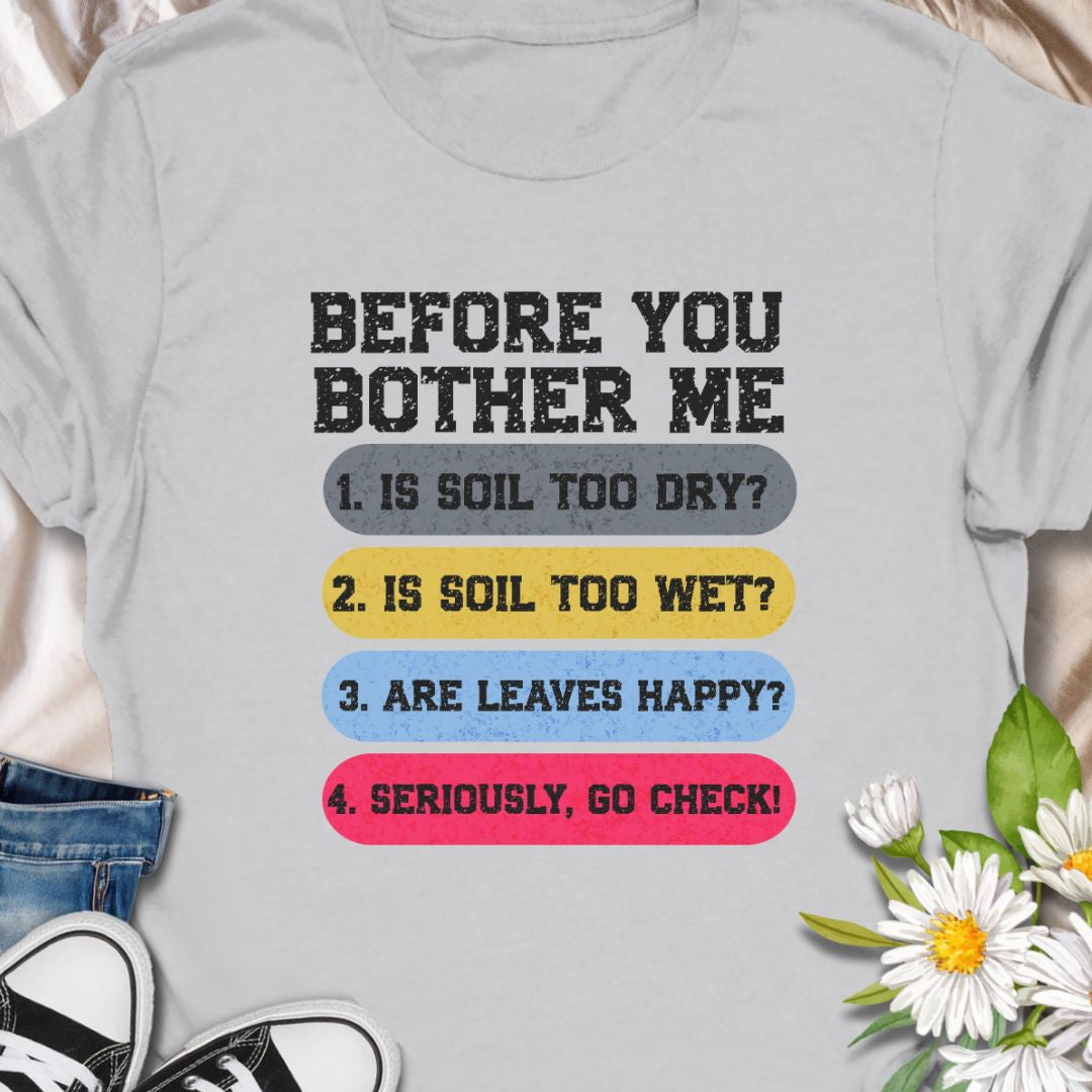 This tee speaks with a wry, green-thumbed voice. The front print lists a gardener’s quick checklist — soil too dry? too wet? are the leaves happy? — finished with a bright, humorous nudge to “go check.” The t-shirt carries a playful, knowledgeable tone that fellow plant lovers will recognize and laugh at.