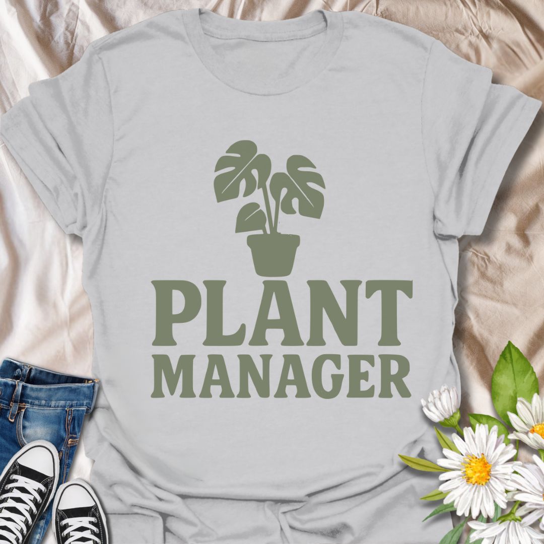 Show your houseplant pride with this humorous "Plant Manager" graphic t-shirt featuring a bold monstera illustration. Perfect for plant parents, gardening enthusiasts, and anyone who takes their indoor jungle seriously—with a sense of humor.
