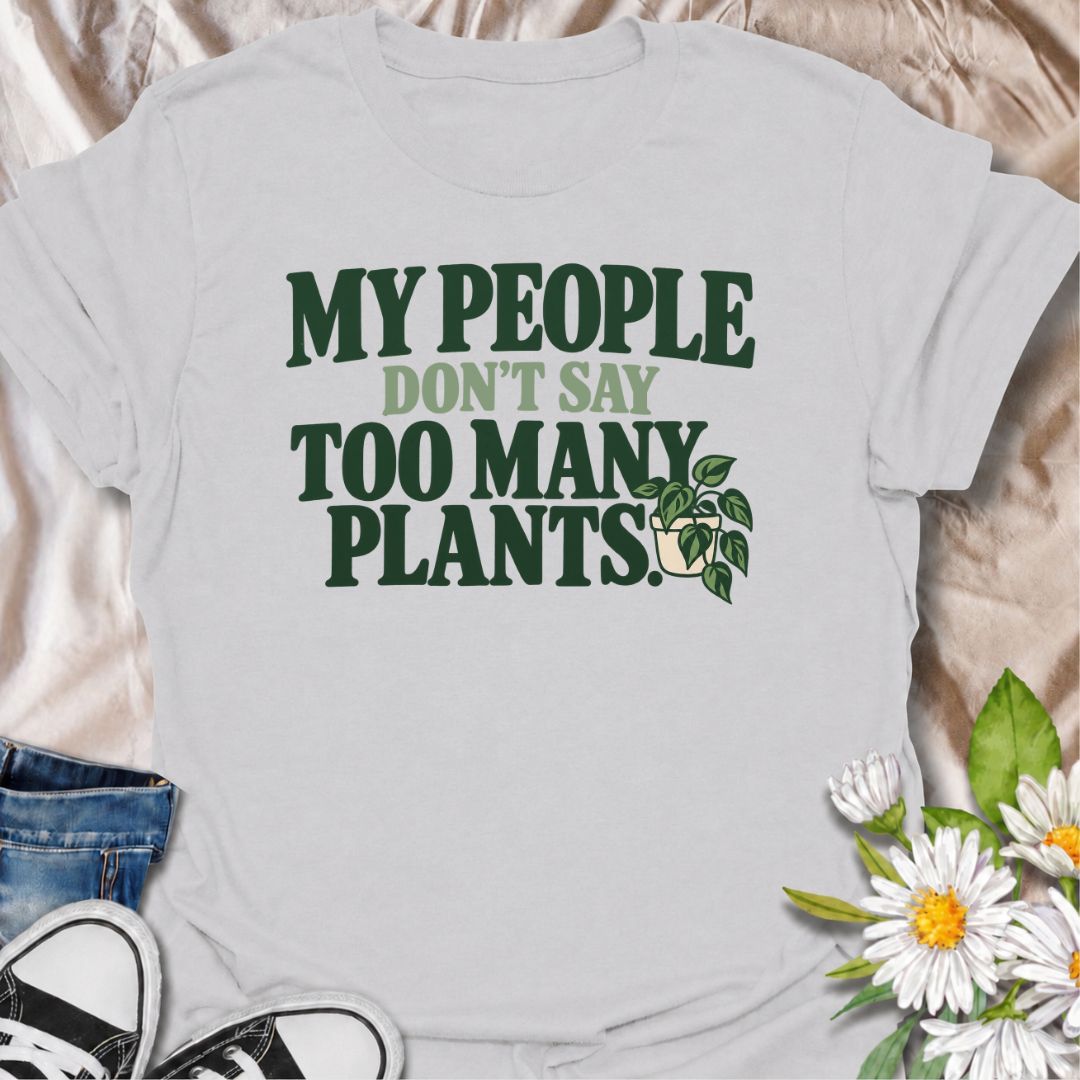 A funny plant T-shirt for anyone who knows the right people never say you have too many plants. The phrase “My People Don’t Say Too Many Plants” turns plant collecting into a little badge of belonging for houseplant lovers and indoor gardeners. Featuring bold retro typography with a simple trailing plant accent, the design stays clean, readable, and easy to wear. It makes a great gift for plant parents, nursery regulars, and anyone whose friends fully support one more plant purchase. Perfect for plant swaps