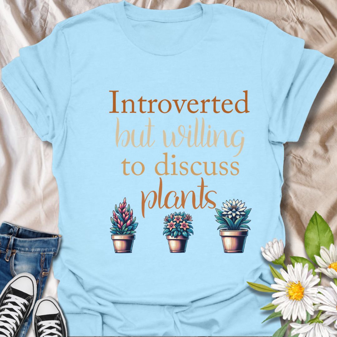 Show off your quiet nature and leafy passions with this “Introverted but Willing to Discuss Plants” t-shirt. Featuring charming potted plants and playful fonts, it’s perfect for plant lovers who prefer petals over people.