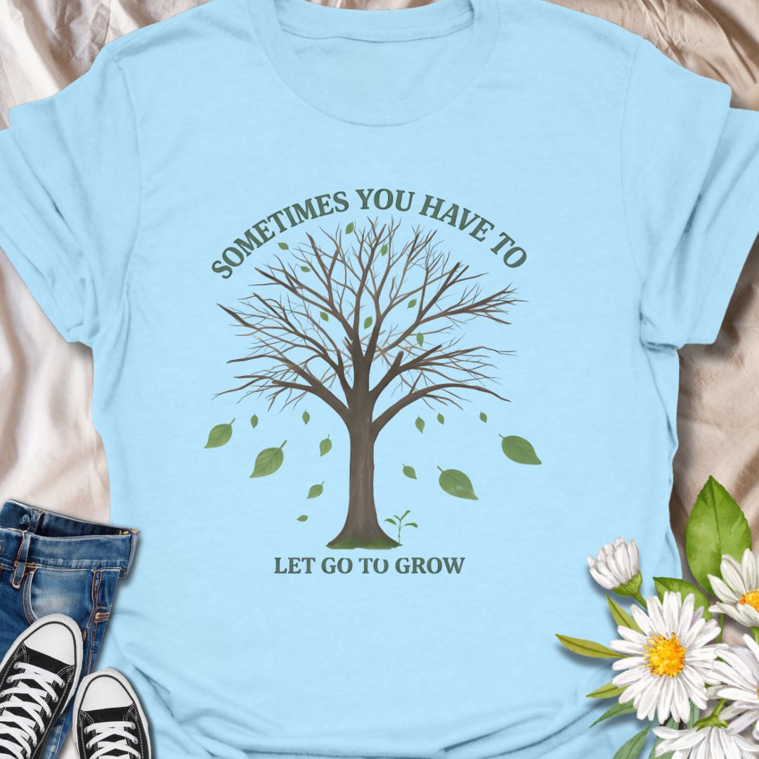 Embrace change and personal growth with this inspirational “Sometimes You Have to Let Go to Grow” t-shirt. Featuring a minimalist tree shedding leaves, this motivational nature-themed design is perfect for anyone navigating transformation, healing, or new beginnings. A thoughtful gift for plant lovers, nature fans, or those on a journey of self-growth.