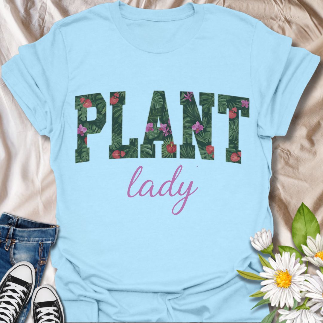 Show off your green thumb in style with this vibrant “Plant Lady” graphic t-shirt featuring bold botanical lettering and a feminine touch. Perfect for plant moms, garden lovers, and anyone who proudly embraces their love for all things leafy and green.