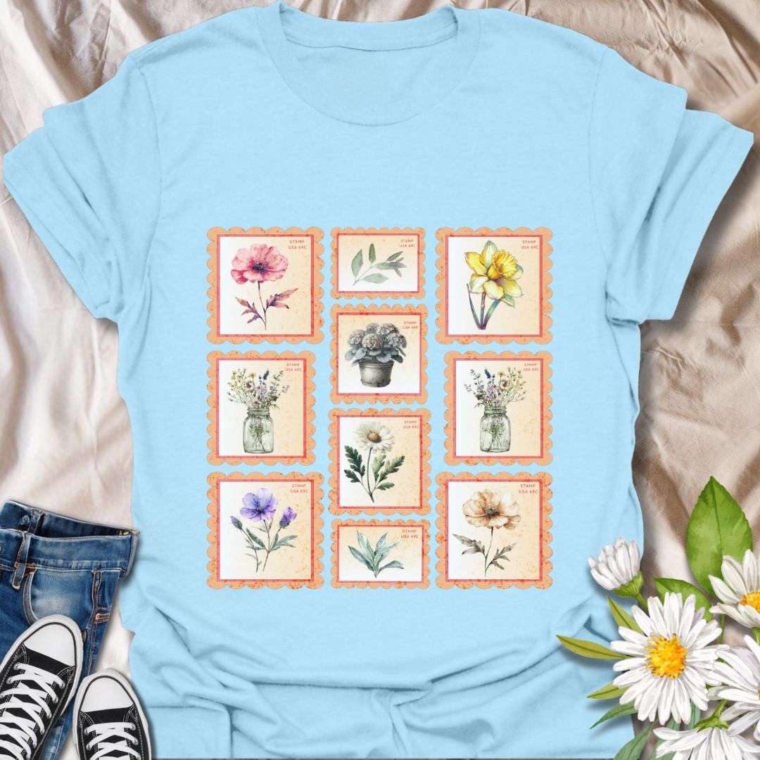 Vintage floral postage stamp t-shirt featuring watercolor botanical prints framed like charming retro stamps. Perfect for flower lovers, gardeners, cottagecore fans, and nature-inspired fashion. Ideal gift for plant moms, wildflower enthusiasts, and those who adore vintage aesthetics