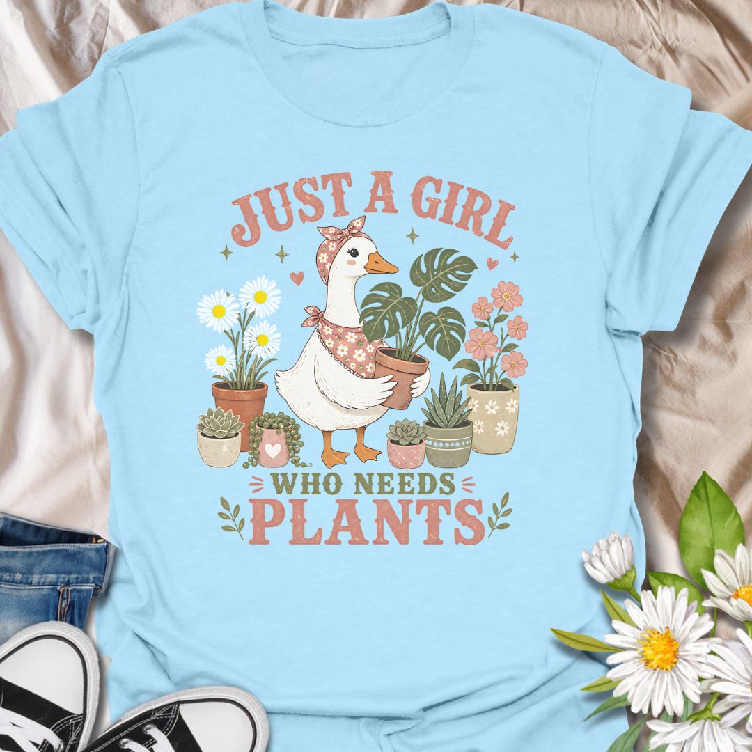 This Just A Girl Who Needs Plants t-shirt is made for plant lovers who know leafy friends, flowers, and a little garden time can fix almost anything. Featuring a sweet goose holding a potted monstera, surrounded by daisies, succulents, flowering plants, hearts, and soft botanical details, this design has a cute cottagecore-inspired feel. Perfect for plant moms, gardeners, houseplant collectors, flower fans, and anyone who proudly needs more plants in their life.