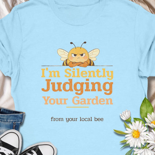 Let your inner bee do the talking with this hilarious “I’m Silently Judging Your Garden” T-shirt featuring a grumpy bee. Perfect for gardeners, plant lovers, and pollinator protectors with a sarcastic sense of humor. A playful gift for bee enthusiasts and backyard botanists alike.