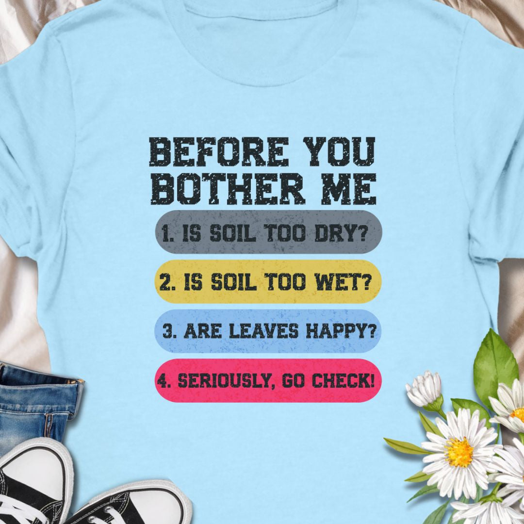 This tee speaks with a wry, green-thumbed voice. The front print lists a gardener’s quick checklist — soil too dry? too wet? are the leaves happy? — finished with a bright, humorous nudge to “go check.” The t-shirt carries a playful, knowledgeable tone that fellow plant lovers will recognize and laugh at.