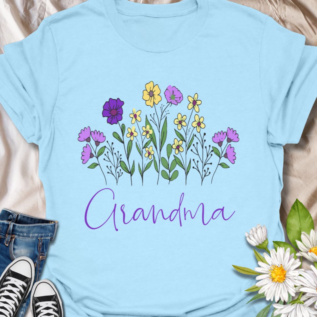 Celebrate the love of a grandmother with this beautiful "Grandma" floral t-shirt. Featuring a charming hand-drawn bouquet and elegant script, this tee is the perfect gift for birthdays, Mother's Day, or just because. Ideal for flower-loving grandmas who bloom with love and wisdom.