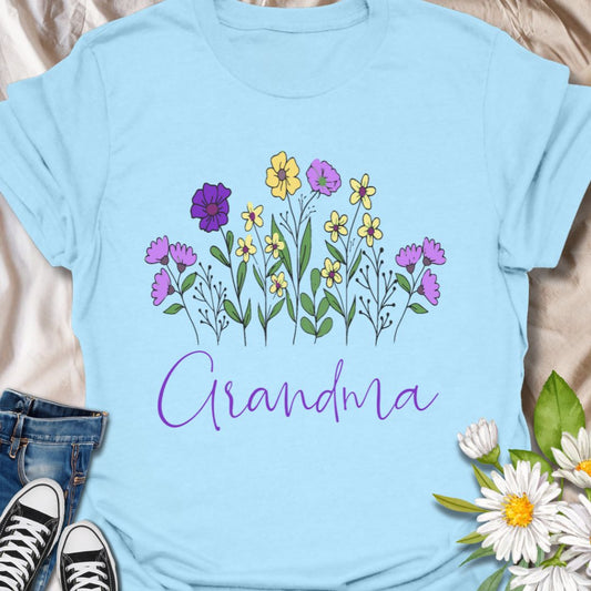 Celebrate the love of a grandmother with this beautiful "Grandma" floral t-shirt. Featuring a charming hand-drawn bouquet and elegant script, this tee is the perfect gift for birthdays, Mother's Day, or just because. Ideal for flower-loving grandmas who bloom with love and wisdom.
