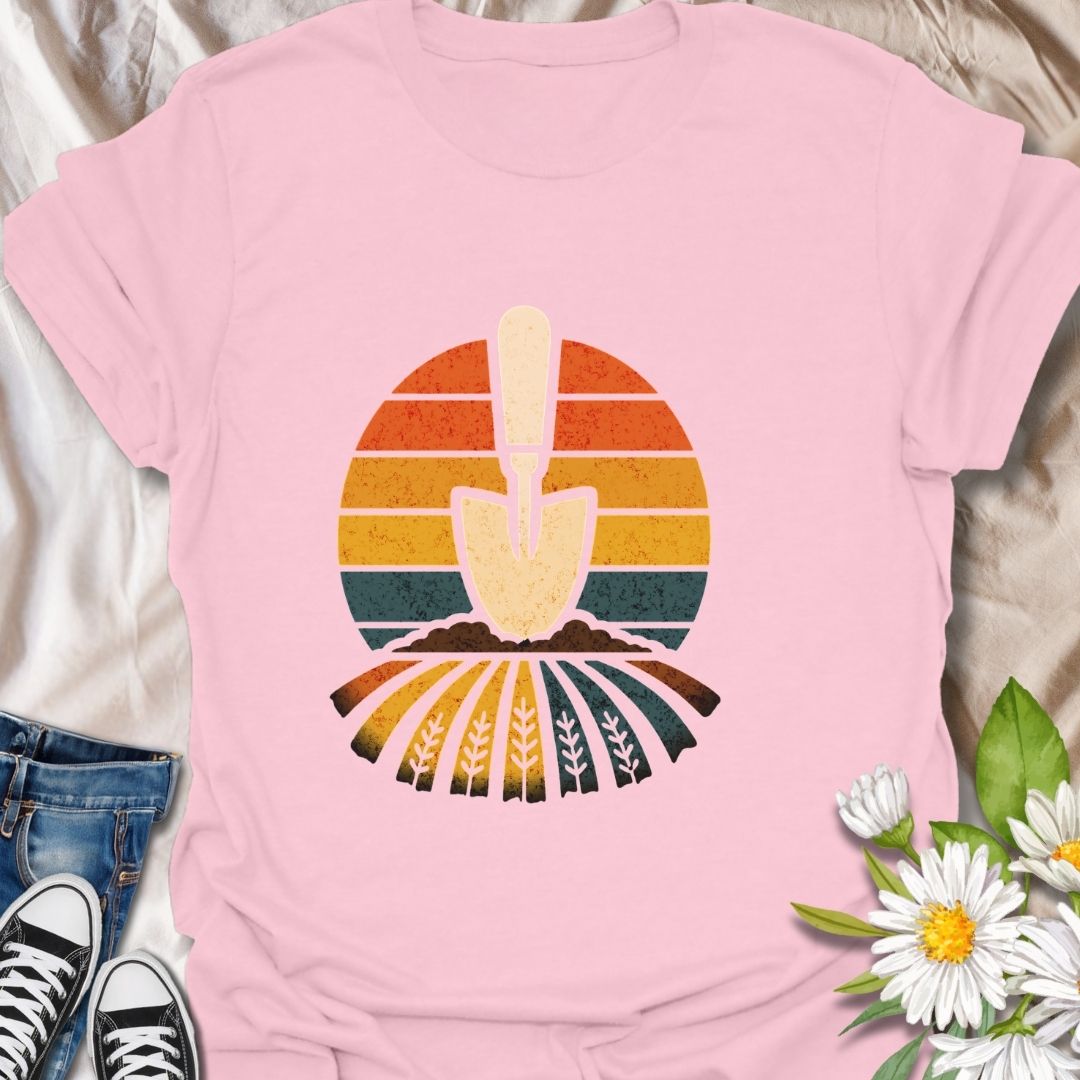 Retro gardening t-shirt featuring a vintage-style trowel and sunset field design. Perfect gift for gardeners, farmers, and nature lovers. Bold and earthy outdoor wear.