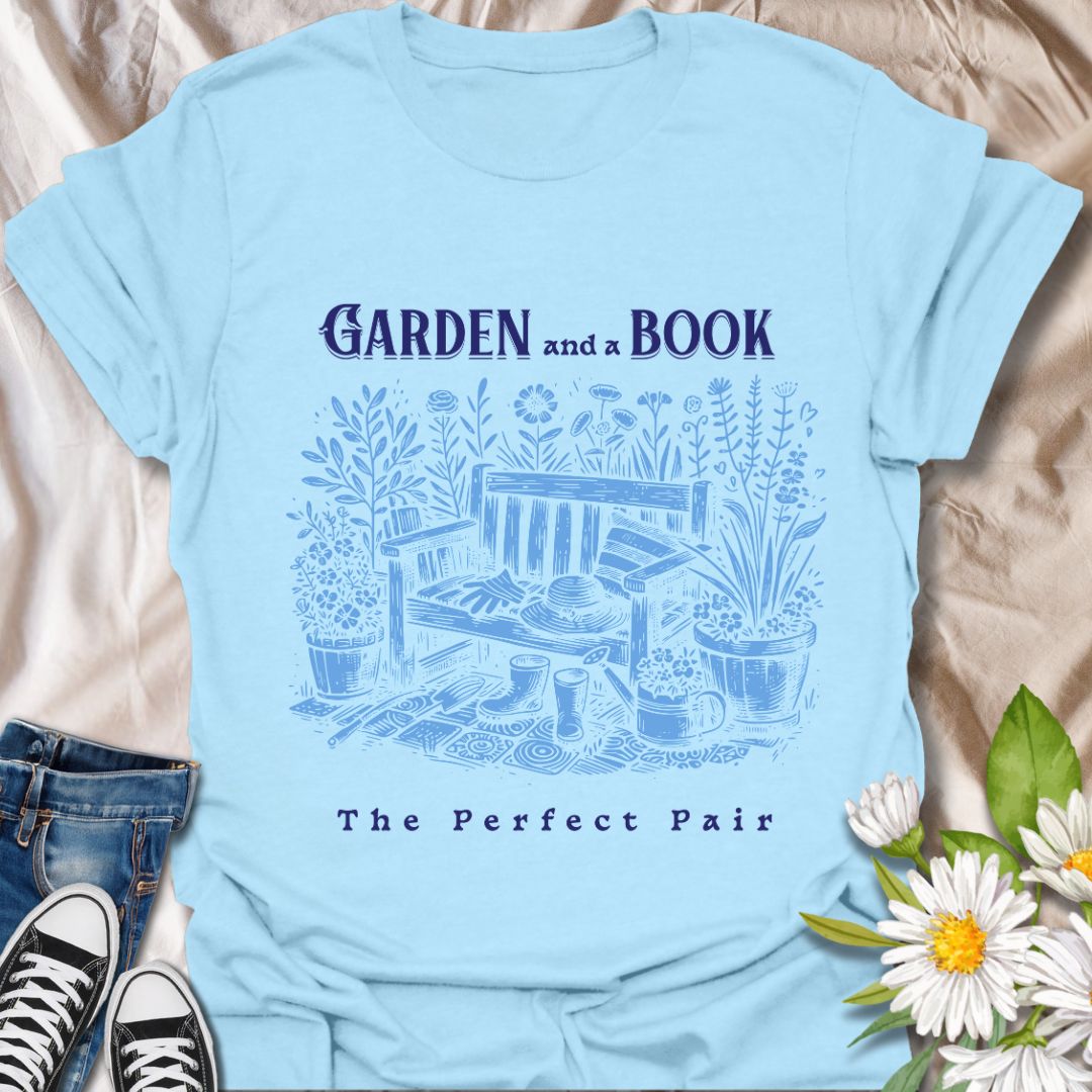 Charming “Garden and a Book - The Perfect Pair” t-shirt featuring a vintage-style garden bench, flowers, potted plants, gloves, boots, and a sun hat. Ideal gift for bookworms, gardeners, plant lovers, and anyone who enjoys relaxing outdoors with a good read.