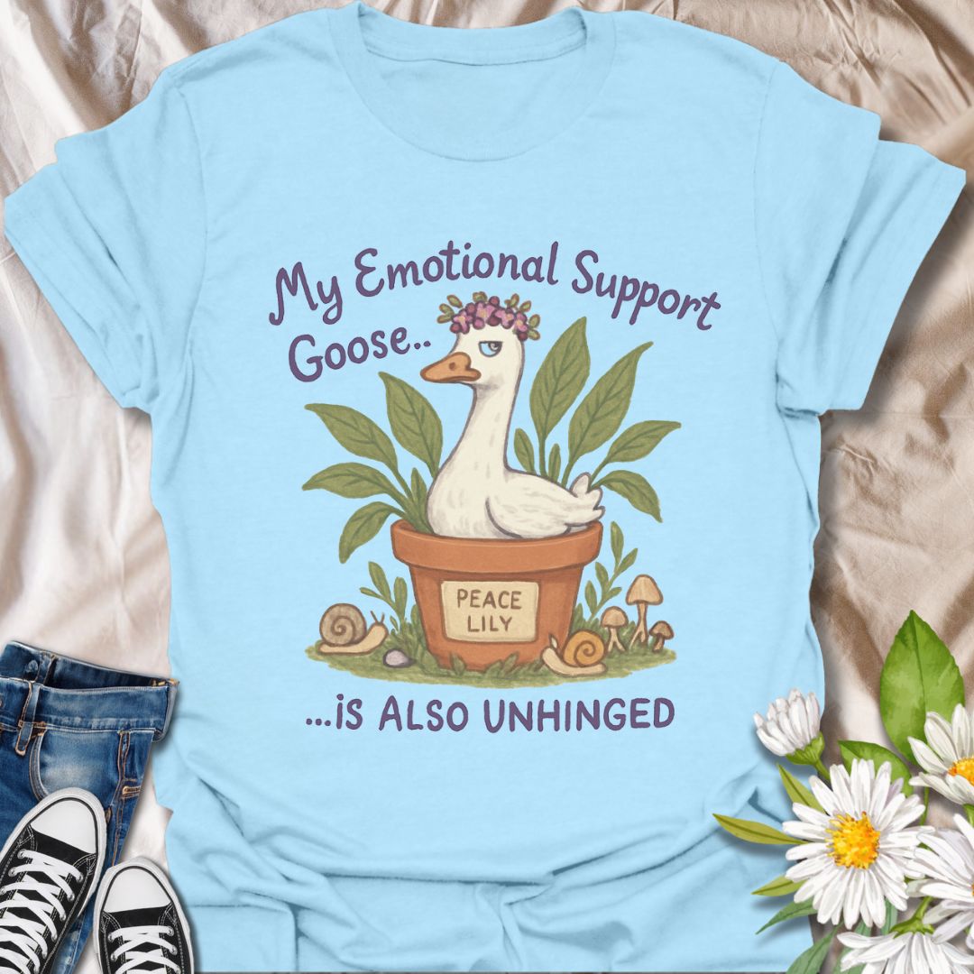Hilarious and quirky t-shirt featuring a peace lily plant pot and an unhinged “emotional support goose.” This fun design is perfect for plant lovers, mental health warriors, and anyone with a wild sense of humor. A unique gift for gardeners and goose enthusiasts alike!