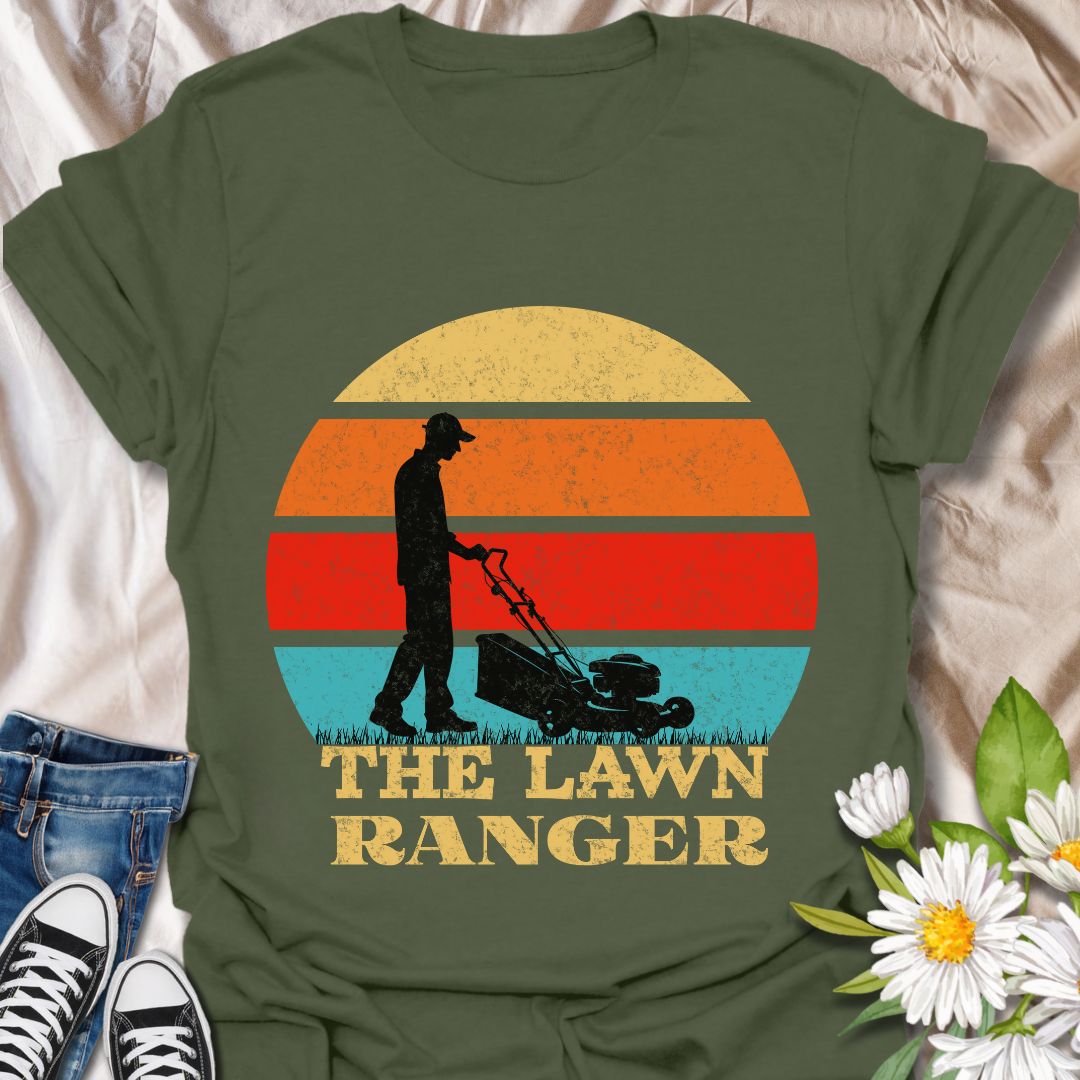 Hilarious retro-style t-shirt with a sunset silhouette of a man mowing the lawn and the phrase “The Lawn Ranger.” Perfect for dads, garden enthusiasts, or anyone who takes mowing seriously (or not!). Great gift for Father's Day or yard work pros. Military Green