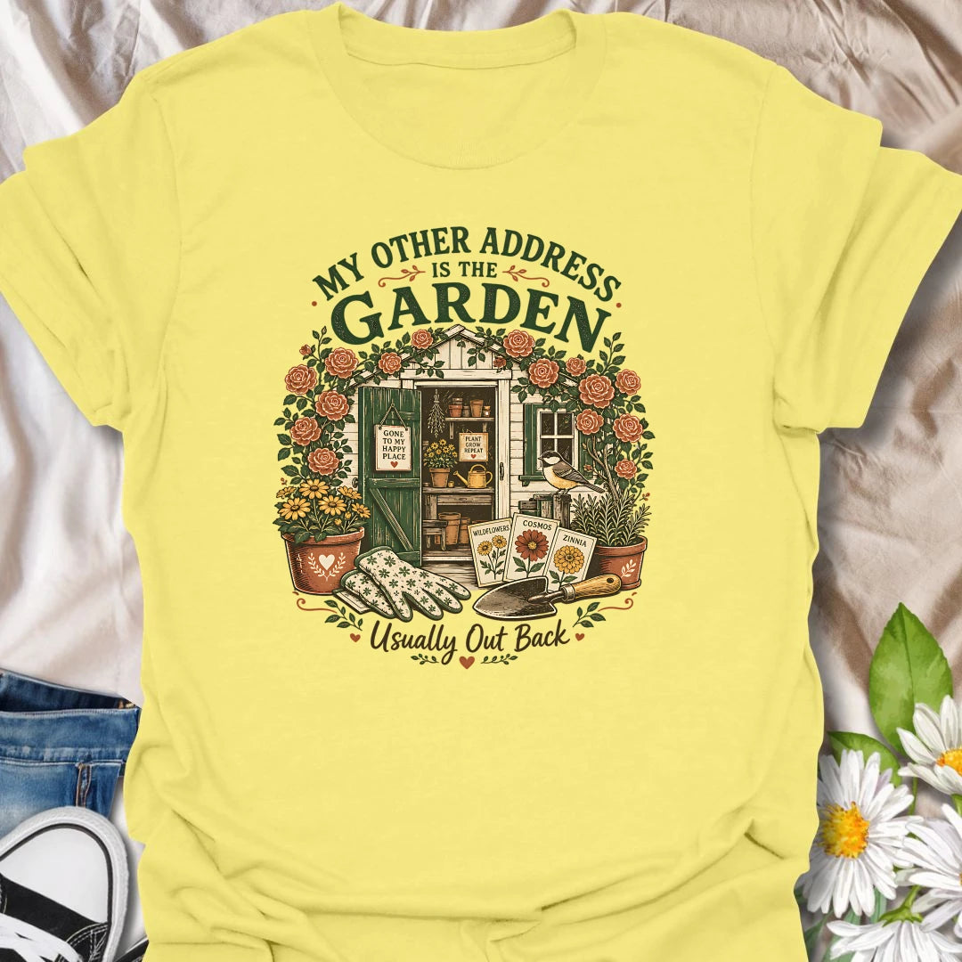 Garden shed t-shirt for plant lovers who feel most at home outside among roses, seed packets, gloves, and garden tools.