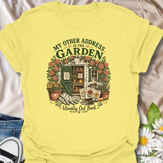 Garden shed t-shirt for plant lovers who feel most at home outside among roses, seed packets, gloves, and garden tools.