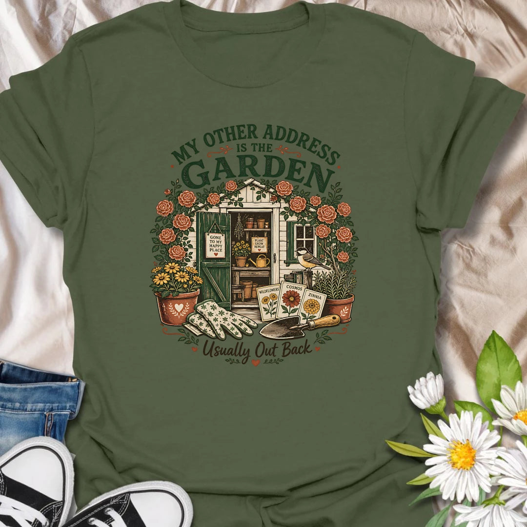 Garden shed t-shirt for plant lovers who feel most at home outside among roses, seed packets, gloves, and garden tools.