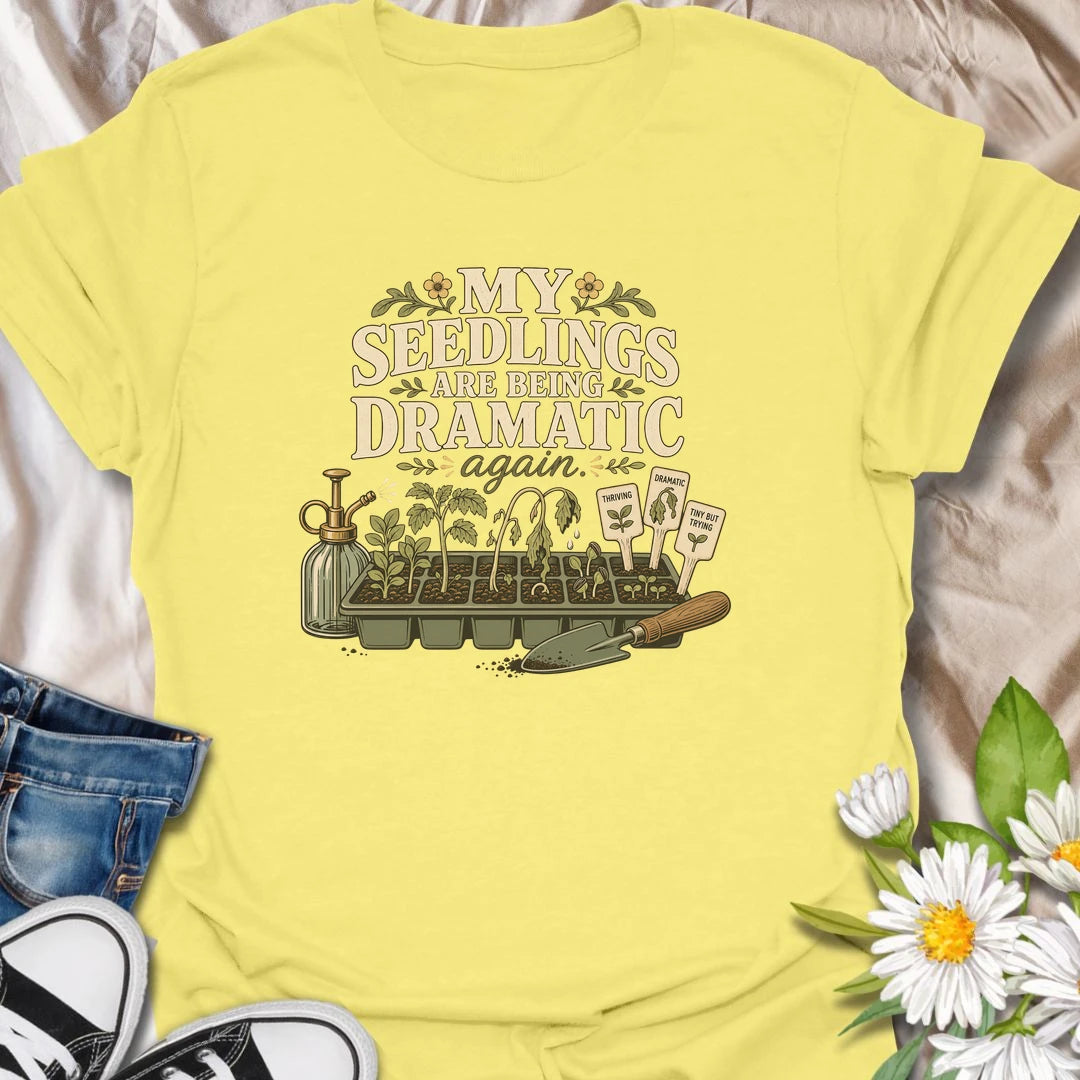 Seed-starting season comes with plenty of drama, and this funny gardening T-shirt understands. Featuring the phrase “My Seedlings Are Being Dramatic Again,” it includes wilted sprouts, plant markers, a mister, and a hand trowel. A perfect gift for vegetable gardeners and seed-starting enthusiasts.