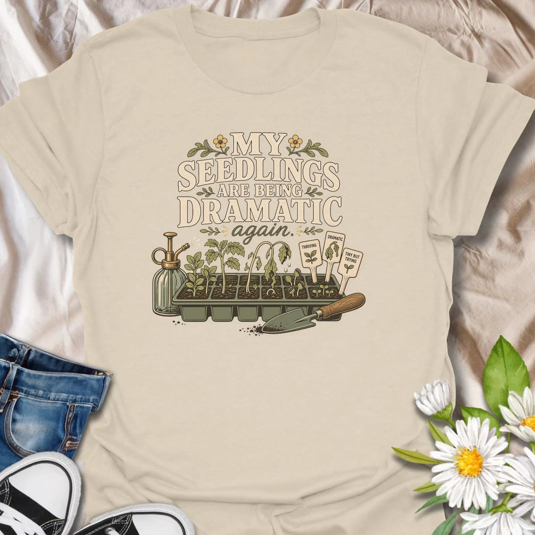 Seed-starting season comes with plenty of drama, and this funny gardening T-shirt understands. Featuring the phrase “My Seedlings Are Being Dramatic Again,” it includes wilted sprouts, plant markers, a mister, and a hand trowel. A perfect gift for vegetable gardeners and seed-starting enthusiasts.