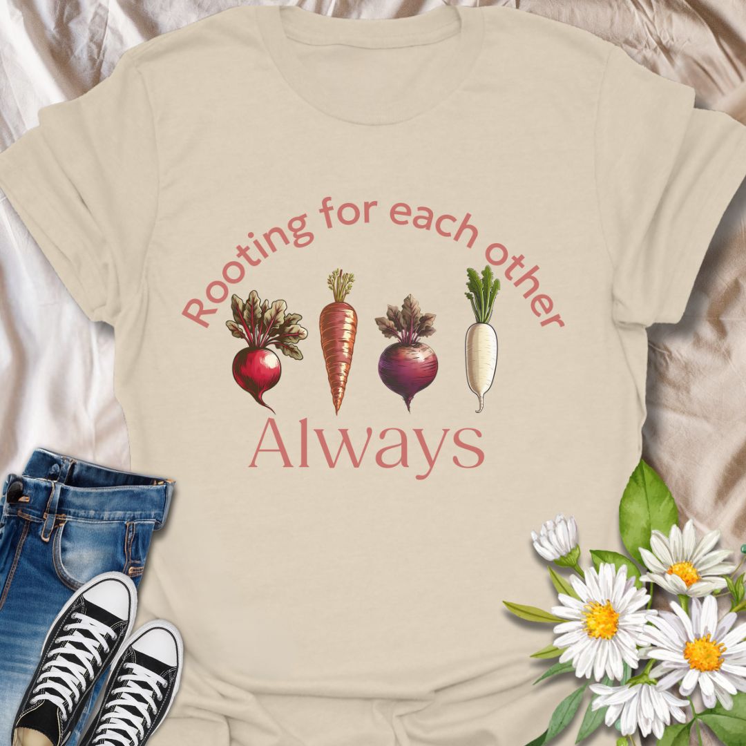 Playful vegetable pun t-shirt featuring carrots, beets, turnips, and radishes with the phrase ‘Rooting for each other always.’ A perfect gift for gardeners, veggie lovers, plant moms, and anyone who loves wholesome humor and plant-based designs