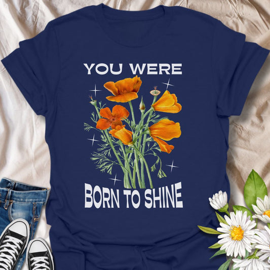 Shine bright with this motivational floral graphic t-shirt featuring vibrant orange poppies and the uplifting phrase "You Were Born to Shine." Perfect for positivity seekers, flower lovers, and anyone who enjoys bold, inspirational, and nature-inspired apparel.
