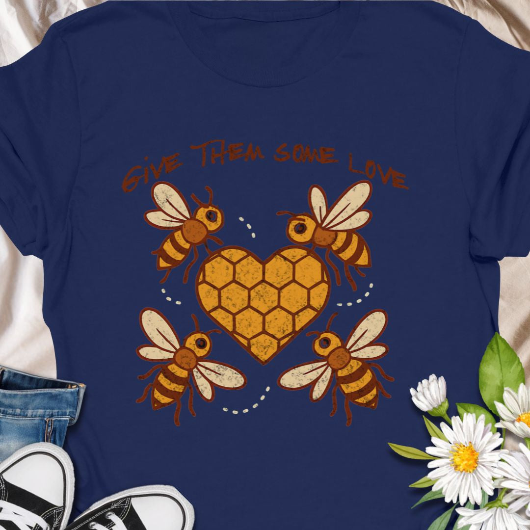 Show your support for the bees with this adorable “Give Them Some Love” t-shirt featuring four cartoon bees buzzing around a heart-shaped honeycomb. It’s the perfect nature-inspired shirt for bee lovers, pollinator advocates, and environmentalists. A sweet way to spread awareness and style!