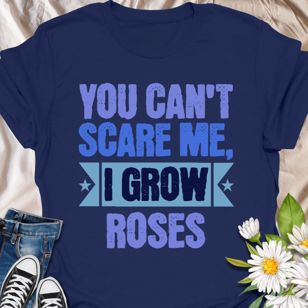 Show off your fearless green thumb with this bold "You Can't Scare Me, I Grow Roses" t-shirt. Designed for confident gardeners and rose enthusiasts who know the thorny truth of growing beauty. A perfect gift for plant lovers who aren’t afraid of a few pricks!