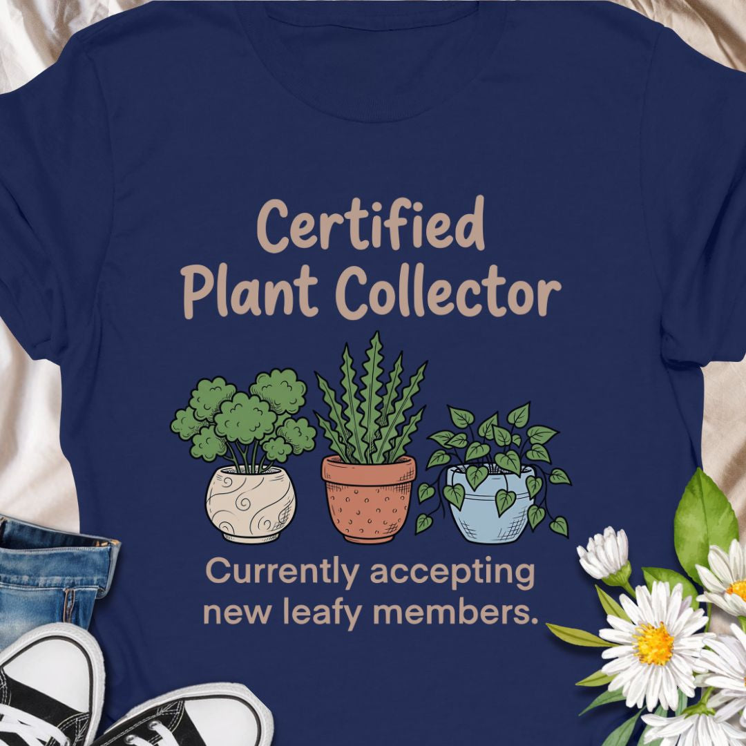 Show off your green thumb with this “Certified Plant Collector” t-shirt featuring charming potted plants and the phrase “Currently accepting new leafy members.” Perfect for plant parents, indoor jungle enthusiasts, or anyone who can’t resist bringing home another plant. A cozy and fun gift for birthdays or plant swaps.