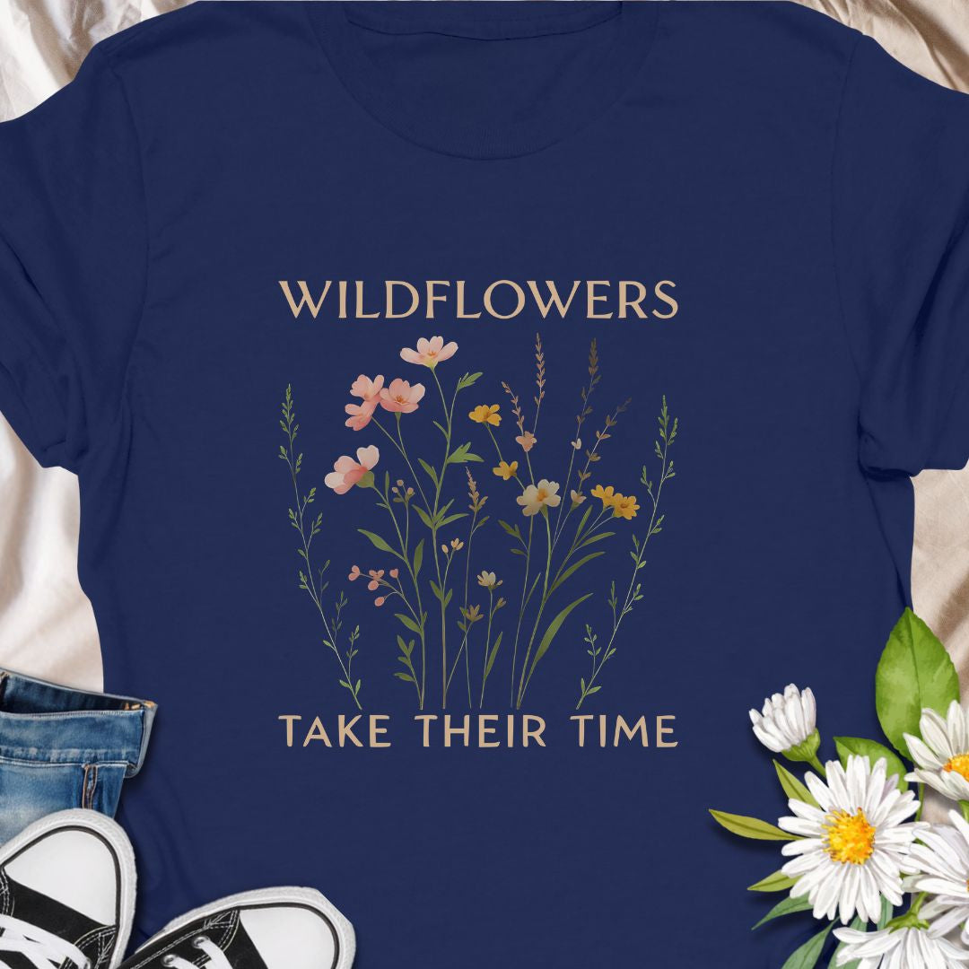 Inspirational wildflower tee featuring soft meadow flowers and motivational quote. A calming nature-themed shirt.