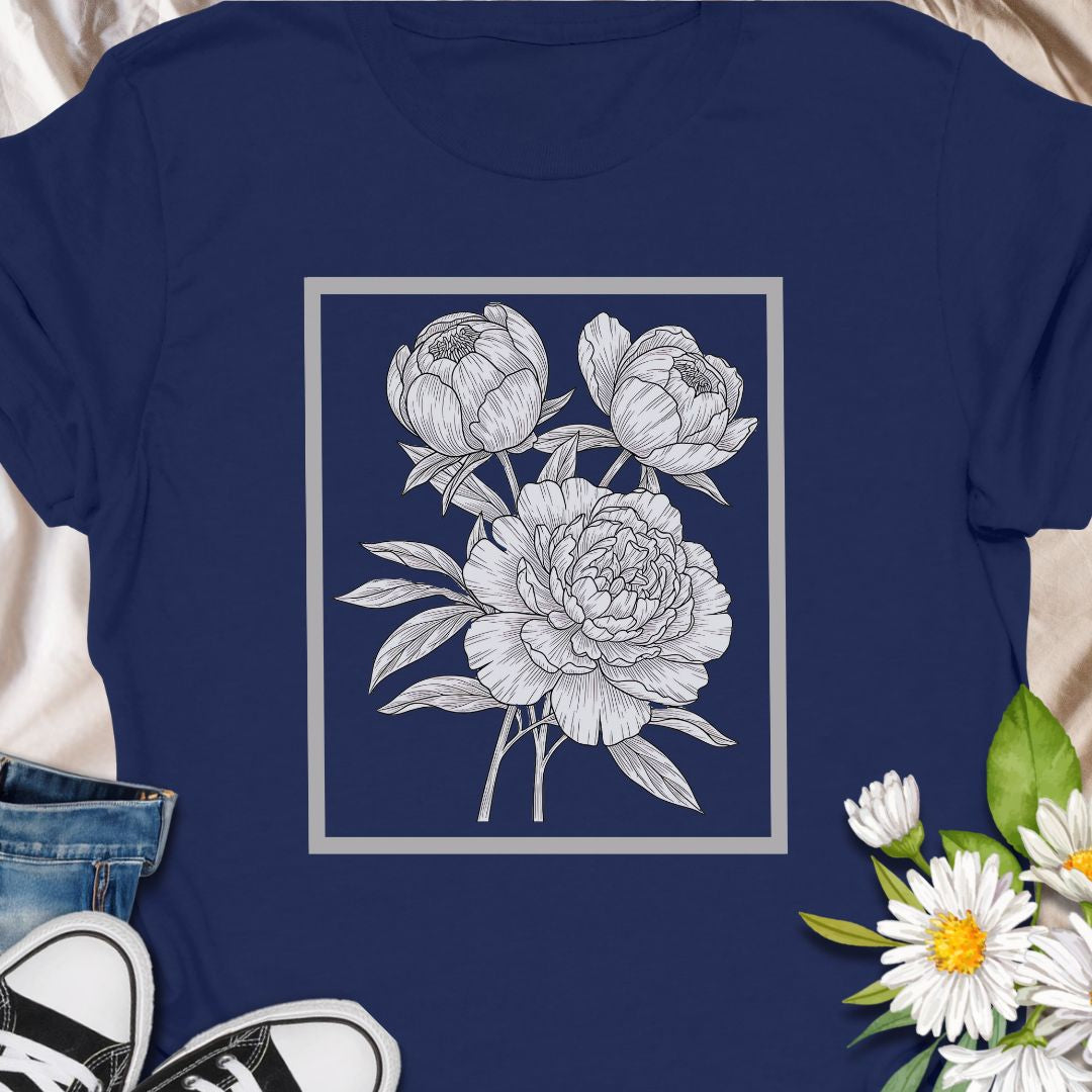 Elegant floral sketch tee featuring detailed peony artwork. Perfect for garden lovers and botanical art fans.  The clean, framed floral sits centered on the chest in fine-line detail — subtle enough to layer under a jacket, expressive enough to stand on its own.