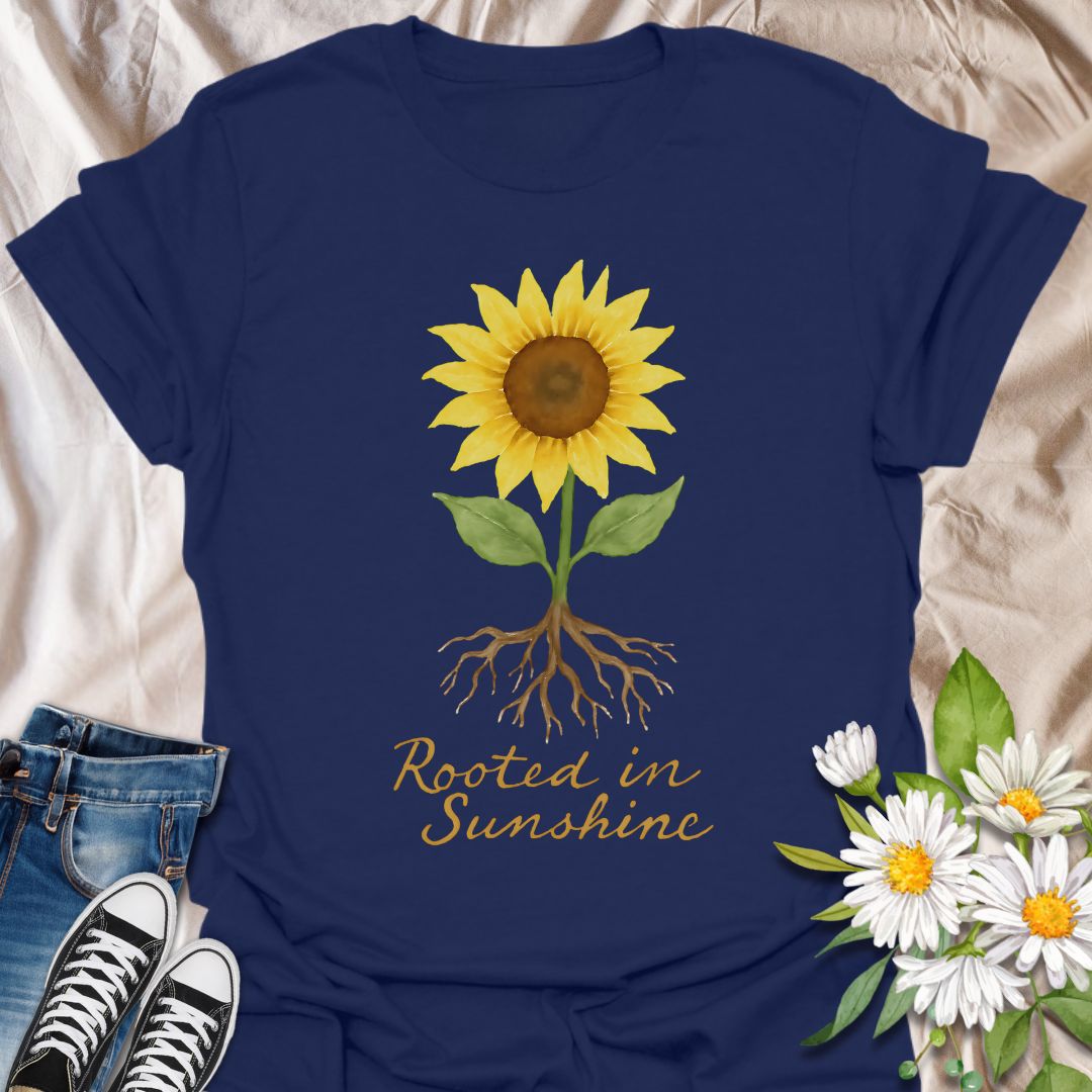 Uplifting sunflower t-shirt with detailed roots and the inspiring phrase ‘Rooted in Sunshine.’ Perfect for nature lovers, gardeners, plant moms, and anyone who finds strength and joy in growth, positivity, and sunshine. A thoughtful gift for self-care, mindfulness, and outdoor enthusiasts.