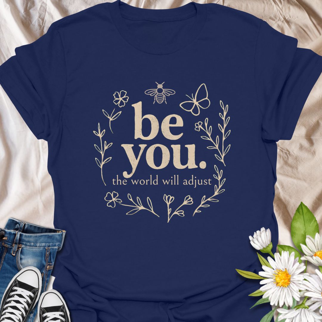 Empower your individuality with this inspiring “be you, the world will adjust” t-shirt design. Featuring whimsical floral and nature-themed elements like bees and butterflies, this uplifting graphic tee promotes self-love, confidence, and authenticity — ideal for free spirits and positivity lovers.