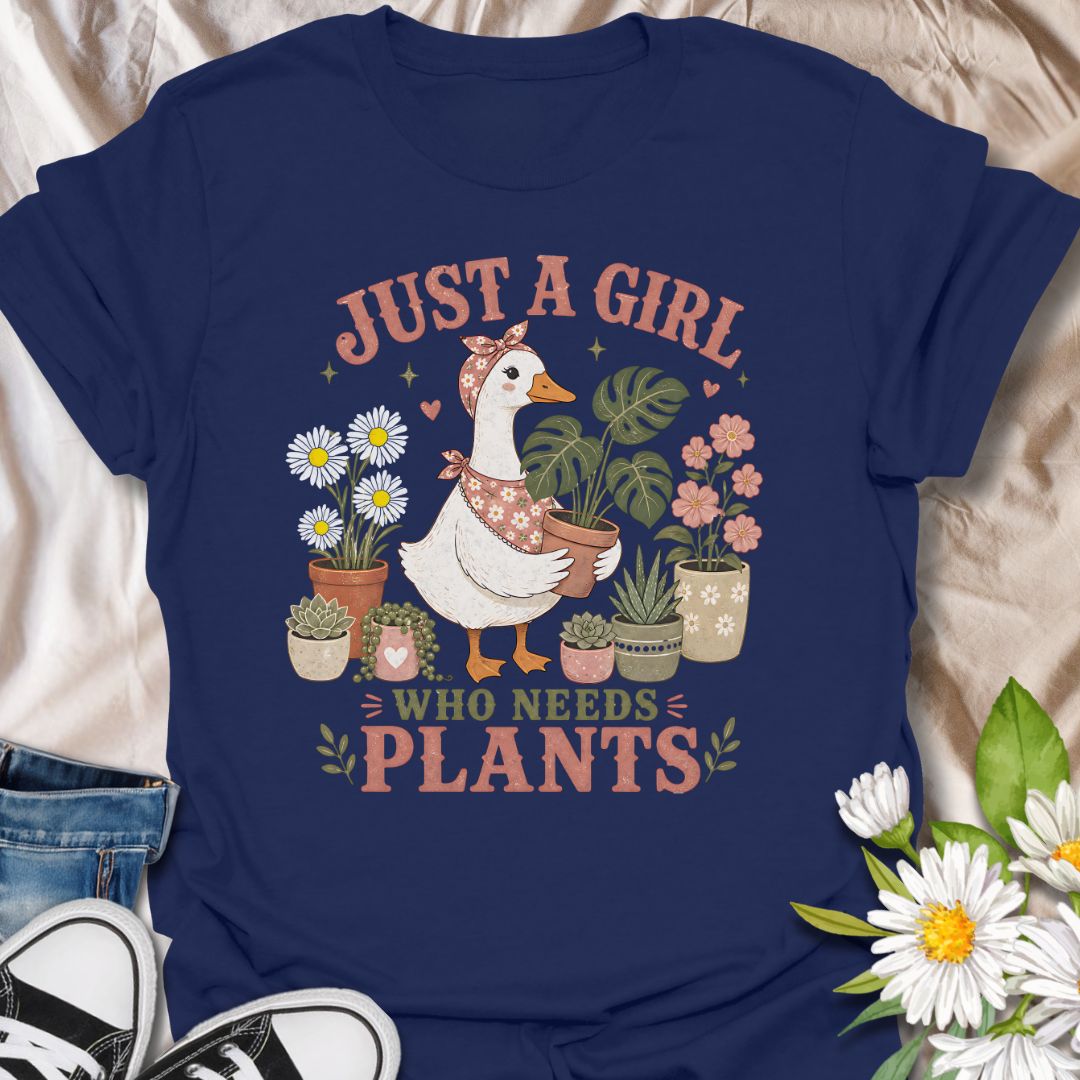 This Just A Girl Who Needs Plants t-shirt is made for plant lovers who know leafy friends, flowers, and a little garden time can fix almost anything. Featuring a sweet goose holding a potted monstera, surrounded by daisies, succulents, flowering plants, hearts, and soft botanical details, this design has a cute cottagecore-inspired feel. Perfect for plant moms, gardeners, houseplant collectors, flower fans, and anyone who proudly needs more plants in their life.
