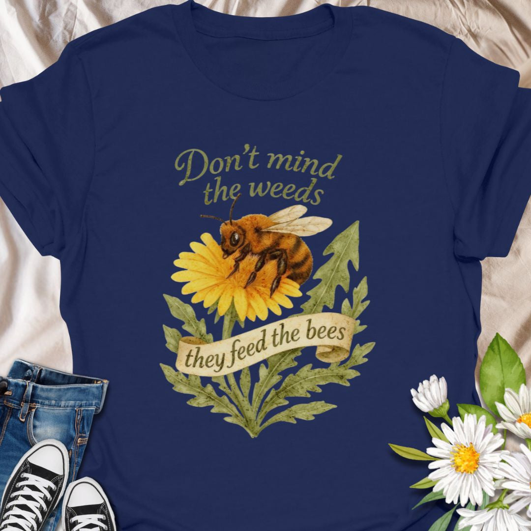 Support pollinators in style with this charming “Don’t Mind the Weeds, They Feed the Bees” t-shirt. Featuring a hand-drawn bee and dandelion artwork, this eco-friendly message tee is perfect for gardeners, nature lovers, and bee advocates who know weeds can be beautiful too.