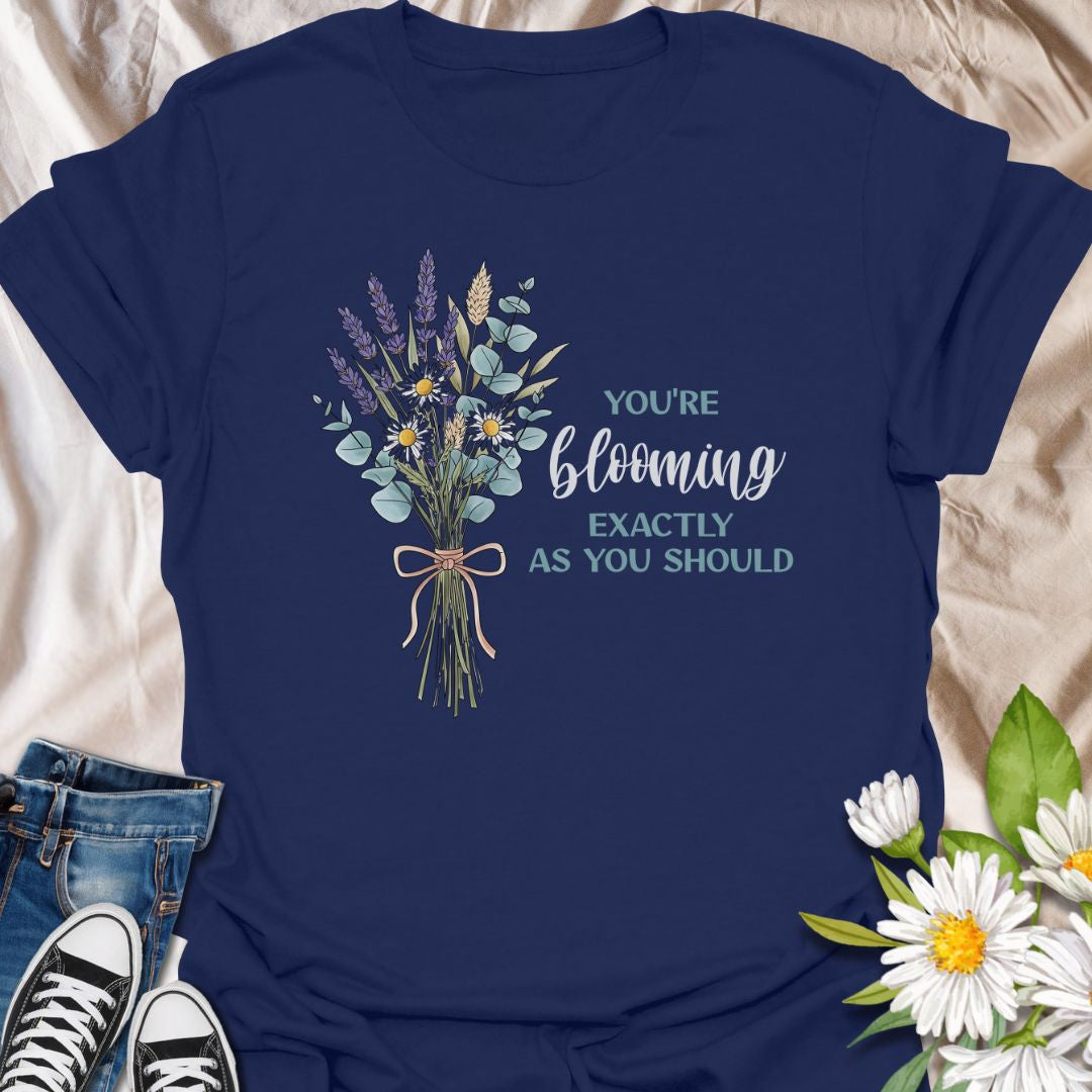 You’re blooming exactly as you should. This uplifting botanical t-shirt features a delicate wildflower bouquet and a positive affirmation celebrating growth, self-confidence, and gentle living. A meaningful gift for plant lovers, gardeners, and anyone on their own blooming journey.