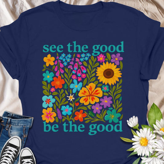 Brighten your day and your outfit with this vibrant floral t-shirt featuring the inspiring message: "See the good, be the good." Perfect for garden lovers, positivity seekers, and anyone who believes in spreading kindness. A cheerful and meaningful gift for plant moms, flower fans, and happy souls alike.