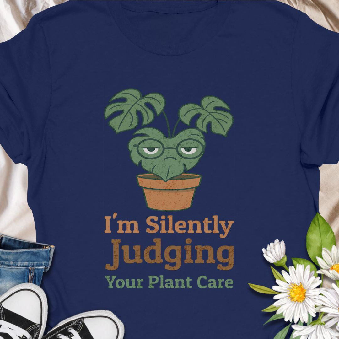 Calling all sassy plant parents – this “I'm Silently Judging Your Plant Care” tee is made for you! Featuring a moody monstera in a pot, it’s perfect for green thumbs who have high standards and a sense of humor. Ideal gift for plant moms, plant dads, and houseplant snobs alike!