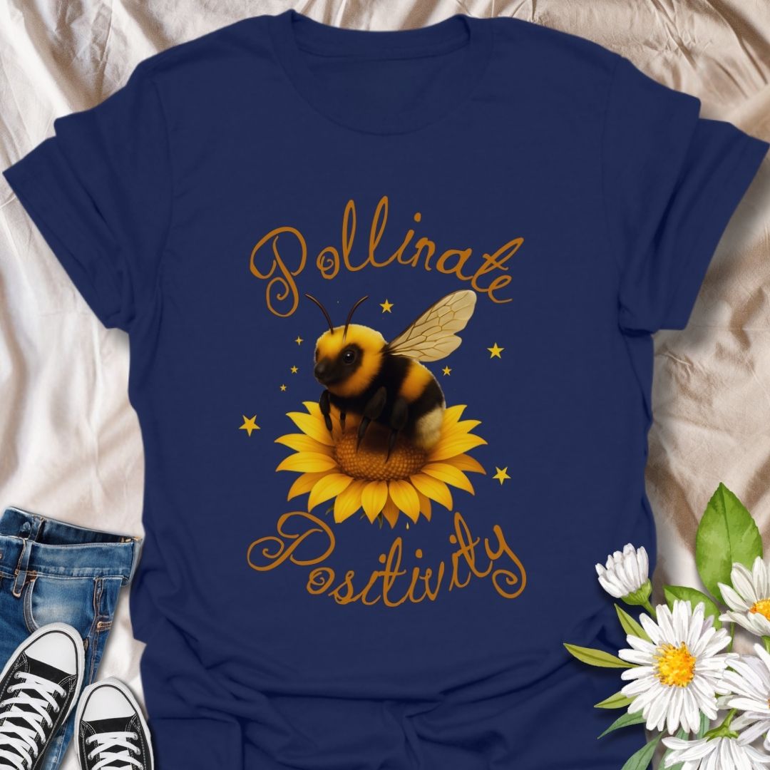 Pollinate Positivity t-shirt featuring a cute bumblebee on a bright sunflower, spreading good vibes and positive energy. Perfect bee lover shirt, nature-inspired graphic tee, gardening gift, or summer aesthetic outfit. Soft, lightweight, and ideal for women, teens, or anyone who loves bees, sunflowers, and inspirational quotes