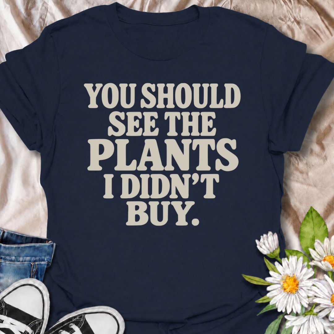 A funny plant T-shirt for anyone whose restraint deserves at least a little recognition. The phrase “You Should See the Plants I Didn’t Buy” delivers dry, self-aware humor that plant parents, nursery regulars, and houseplant collectors will instantly understand. Its bold retro typography keeps the design simple, readable, and easy to wear. It makes a great gift for plant lovers who somehow manage to leave the garden center with fewer plants than they wanted. Perfect for nursery trips, plant swaps, casual we