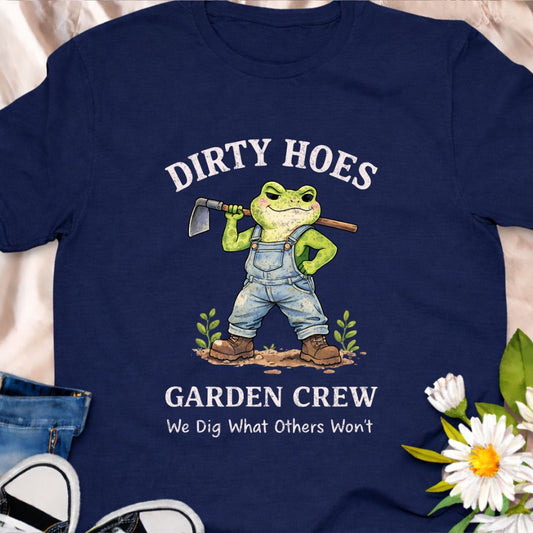 Join the “Dirty Hoes Garden Crew” in style with this cheeky frog gardener t-shirt. A fun punny gardening tee for plant lovers who dig in the dirt and don’t mind getting a little messy in the garden.