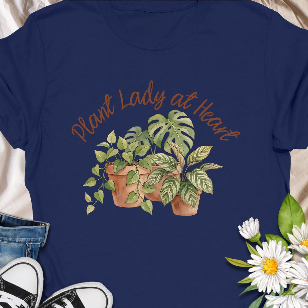 Celebrate your love for greenery with this charming “Plant Lady at Heart” t-shirt. Featuring soft water color-style potted plants and elegant script text, it’s the perfect gift for plant moms, gardeners, and nature enthusiasts. Wear it proudly and show the world that your heart truly belongs to plants—comfort meets style in this must-have tee.