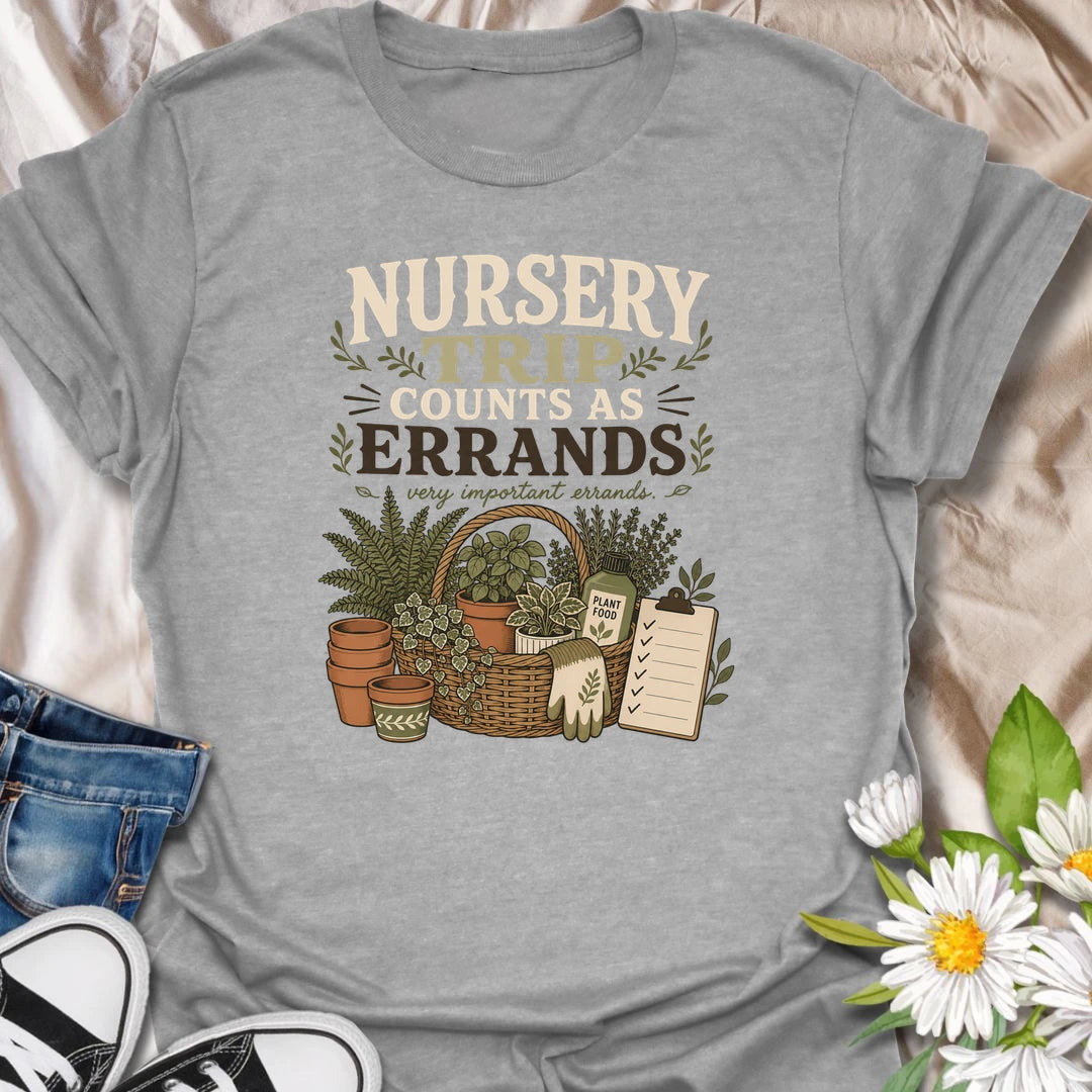 Make every plant-shopping trip feel productive with this “Nursery Trip Counts as Errands” T-shirt. The detailed basket of herbs, pots, garden supplies, and checklist celebrates a gardener’s most important appointments. It is a fun gift for plant lovers who always make time for the nursery.